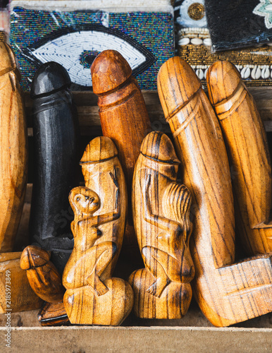 Quadro su tela Traditional Balinese Hand-Carved Wooden Phallus Souvenirs and Bottle Openers at