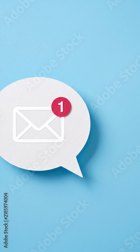 White speech bubble with mail icon and red notification circle with number one, symbolizing a new message, communication, and inbox alert