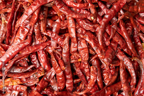 Pile of dried red hot and spicy chili pepper prepared for sale on the supermarket in Thailand,