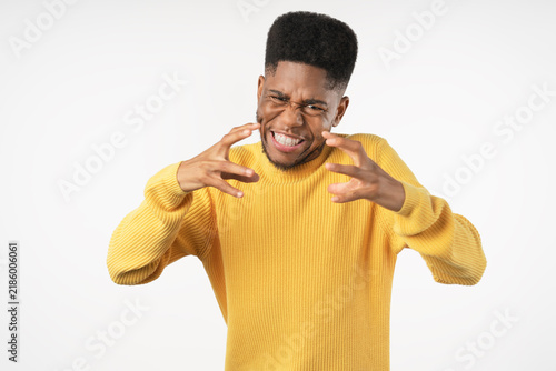 Cuadro en lienzo Portrait of angry young man isolated over white background, frustrated male show