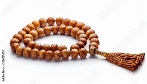 wooden islamic prayer beads tasbih or misbaha with tassel isolated on white background