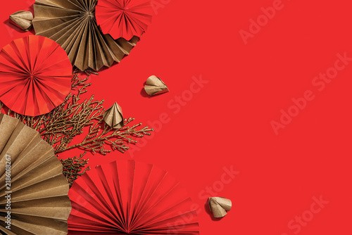 Happy Chinese New Year traditional concept. Oriental asian style paper fans on red background