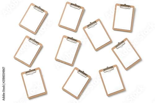 Collection of blank wooden clipboards with metal clips arranged on a clean white background. Minimal office stationery concept with plenty of copy space.