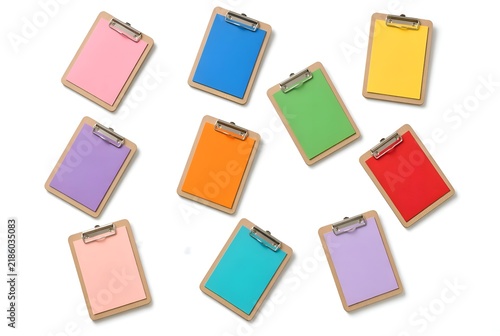 Colorful blank clipboard collection isolated on a white background, featuring pastel and vibrant colored paper sheets with metal clips. Clean minimal composition for office, business, planning and sta