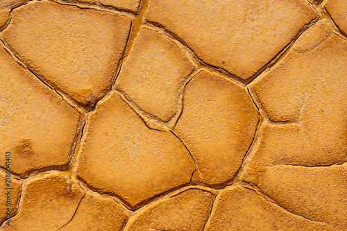 Mineral-Rich Cracked Soil with Orange Pools in Mazarrón Mines, Murcia, Spain