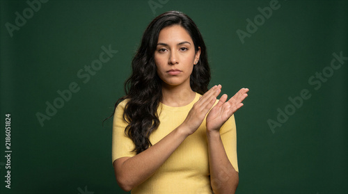 Woman giving an unamused slow clap with a skeptical expression