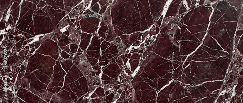 Fotografie Red marble texture background featuring deep burgundy stone surface with bold wh