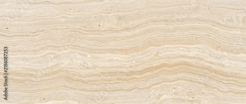 Obraz na płótnie Vein cut travertine texture background with wavy beige stone striations and warm