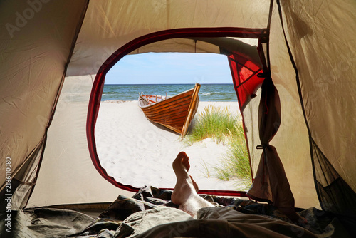 Inside the Tent and look outside – Summer Beach View with Boat and Feet