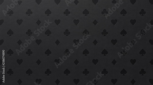 Casino card suits pattern black texture seamless elegant background dark. Subtle embossed hearts clubs diamonds and spades repeat across a dark charcoal surface for gambling advertising campaigns