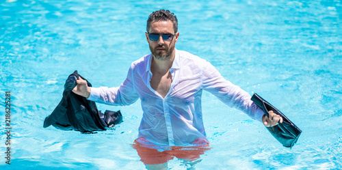 Photography Excited businessman in wet suit in swim pool