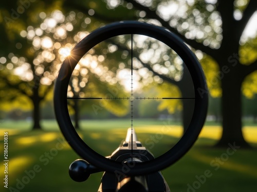 Rifle scope view of a tree with blossoming flowers