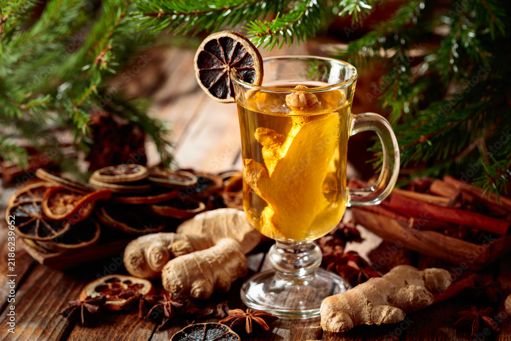 Obraz premium Ginger tea with spices and fir branches.