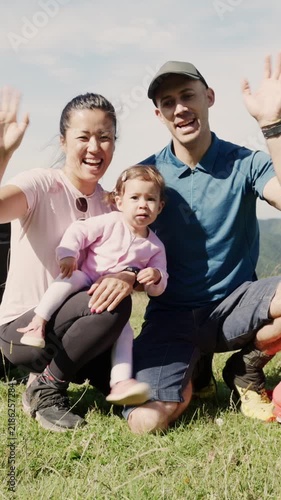 Multiethnic family posing together on a sunny day in the mountains