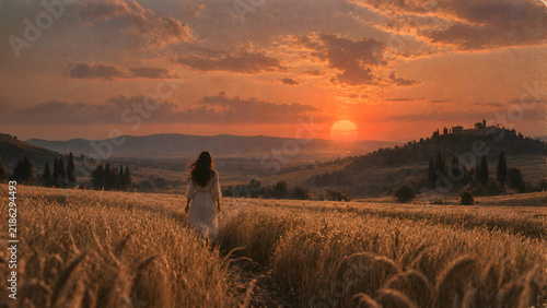 Lone Woman Walking Through a Golden Wheat Field at Sunset