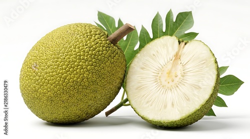 Fresh breadfruit whole and sliced in half with green leaves isolated on white background