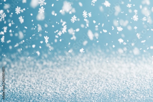 Gentle Snowfall in Winter: Delicate snowflakes drift down against a soft blue backdrop, blanketing the ground in a layer of pristine white snow, creating a serene winter wonderland.