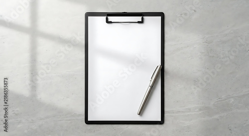 Minimalist black clipboard with blank white paper, professional office stationery mockup on grey stone background, corporate document holder with silver pen