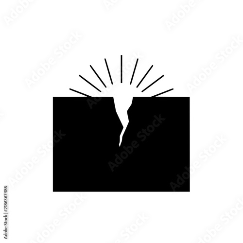Black block icon with crack and radiating light rays