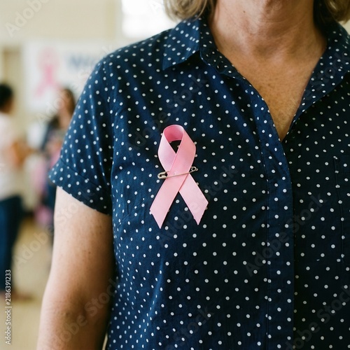 Pink Ribbon Awareness Symbol Displayed On Blue Polka Dot Shirt