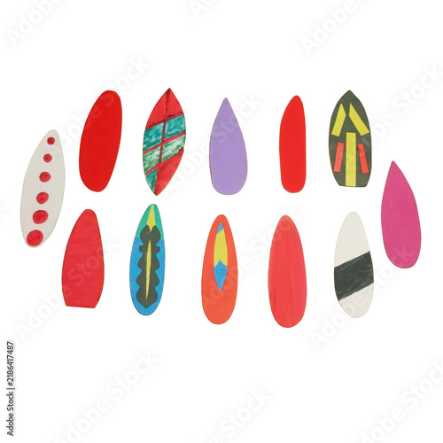 Collection of twelve colorful surfboard shaped paper cutouts with various patterns and solid colors on a white background isolated on a transparent background