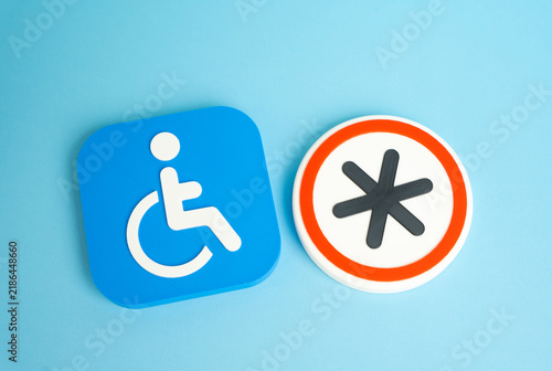Fotografie A disability symbol and a conditions symbol