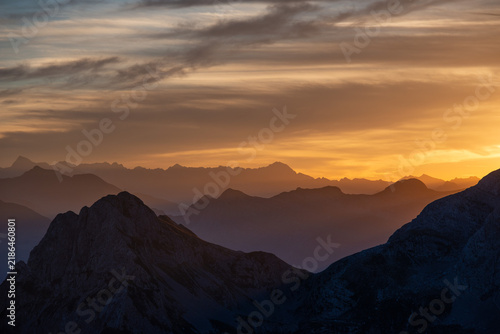 Mountain peaks at sunset with a fiery sky