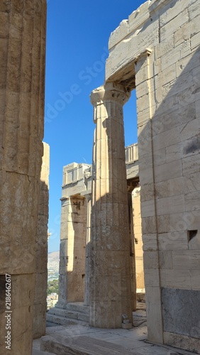 Propylaea, Acropolis of Athens, Greece - 26 June 2026. Fluted Ionic columns stand between massive marble walls and lintels within the Propylaea.