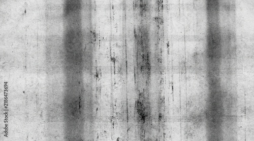 Grunge distressed texture with vertical dark streaks and subtle horizontal grid lines on aged paper