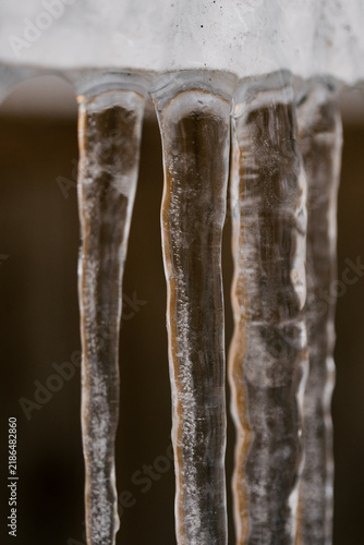 Icicles hanging down with dark background