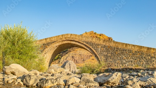 Obraz na płótnie Close-up view of the historical Dort Ulular II Bridge from the 17th century Ottoman period, located in Baykan, Siirt, Turkey