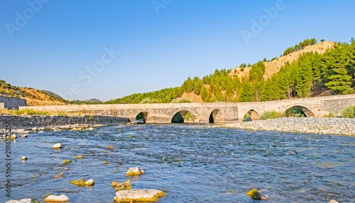 Obraz na plátne Wide angle view of the 81-meter long historical Dort Ulular II Bridge built in the 17th century during the Ottoman era