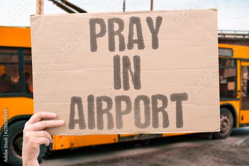 Fotografie "Pray in airport" Passenger seeks designated prayer space or quiet area for religious observance during layover