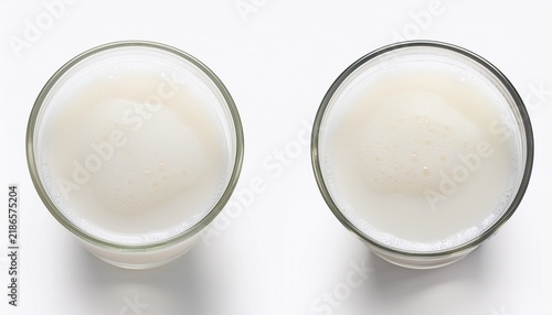 glass of white milk with foam isolated on a white background