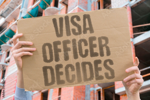 Fotografie "Visa officer decides" A single bureaucrat determines your entire future with no appeal