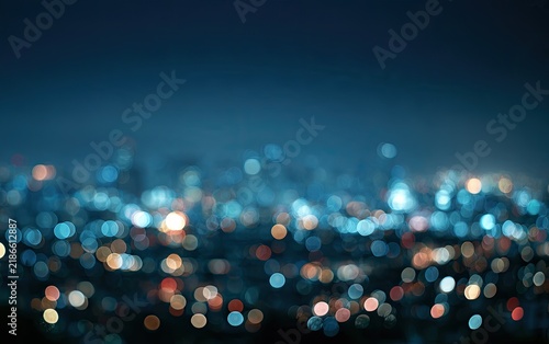 Blurry city lights at dusk, soft bokeh glow