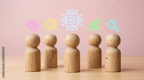 Wooden figures with digital neon technology icons standing on a wooden surface against a pink background