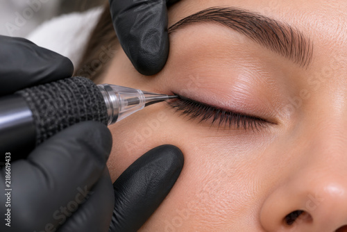 Close-up of professional lash line permanent makeup creating a defined and expressive eyelash contour.