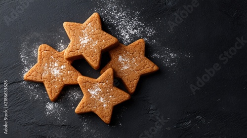 star shaped cookie cutters on dark surface, contrast composition, dramatic baking still life