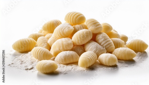 fresh uncooked gnocchi pasta isolated showing classic ridged texture handmade appearance and dusted with flour on a white background