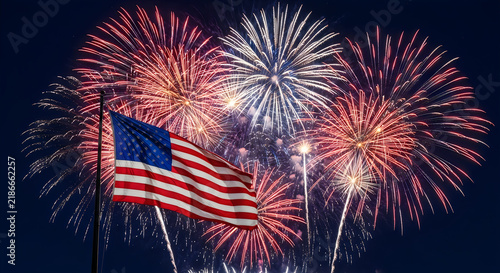Bright colorful fireworks display over the american flag for veterans day celebration