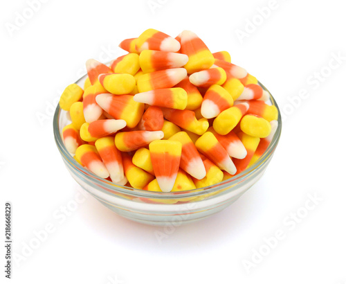 Candy corn in jar on white background