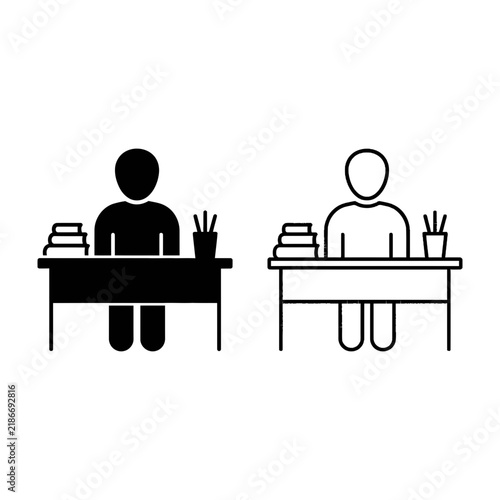 Two students sitting at desks with books and pens in classroom setting for education