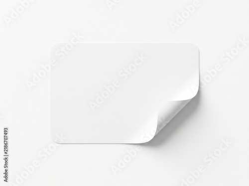 Blank white paper sticker with a curled corner isolated on a white background