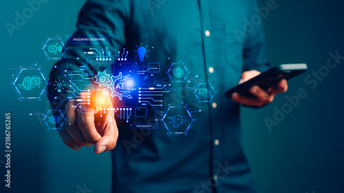 Businessman touching futuristic AI hologram. This smart artificial intelligence technology concept shows digital innovation, network connectivity, cyber security, and business internet data.