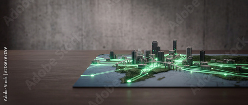Futuristic miniature smart city model on a table featuring glowing green digital network lines and fiber optic data flow for urban planning and technology concepts.