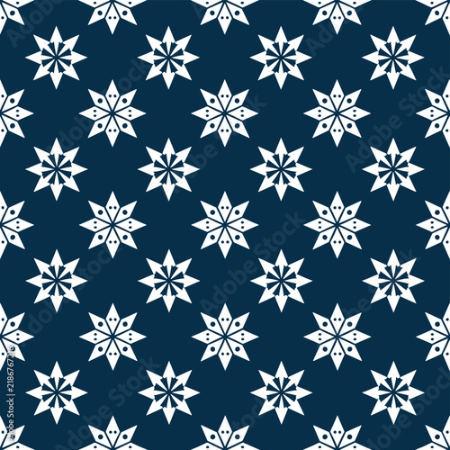 Seamless abstract pattern featuring repeating white geometric star shapes on dark blue background