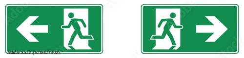 Foto Emergency Exit Signs: Two green safety signs clearly indicate emergency exit directions with pictograms of a running person and arrows pointing left and right