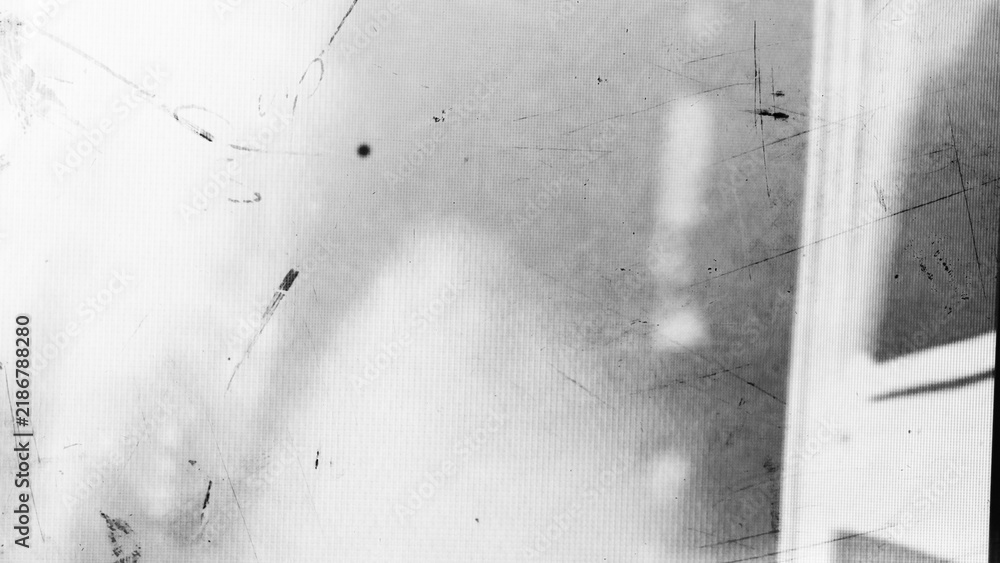 Fototapeta premium Abstract dirty or aging film. Dust particle and grain texture or dirt use for overlay film frame effect. Dust scratches effect for vintage film grunge textured effect design.