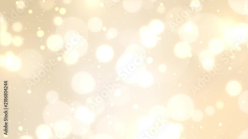 ゴールド背景に舞い散る美しい玉ボケと輝く光の粒子のシームレスループ動画素材 / Glowing bokeh and shining light particles loop on golden gradient background